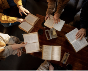 People reading scripture during a Bible Study